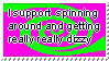Animated blinkie of a colorful neon purple and green spiral. It reads 'I support spinning around and getting real dizzy'